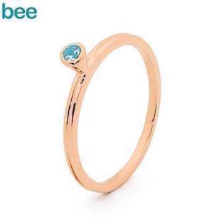 Pink gold plated ring in 9 ct. with blue topaz